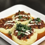 Purée de pommes de terre farci à la viande